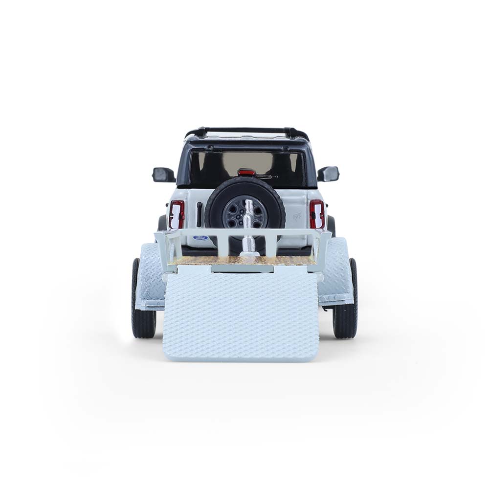 Bronco 4-Door Badlands in Cactus Grey with Utility Trailer and Motorcycle